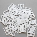 plastic nursing bra strap clips CN-800 white from Bra-Makers Supply bulk bag of 100 clips shown