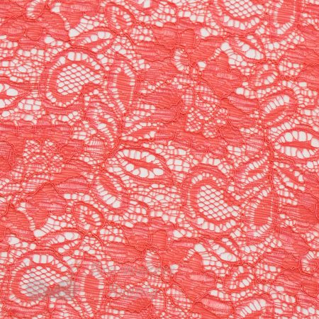 coral coloured lace fabric