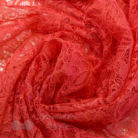 coral coloured lace fabric